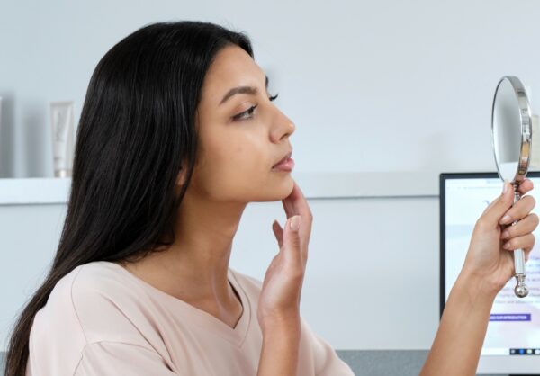 Image of lady looking in the mirror